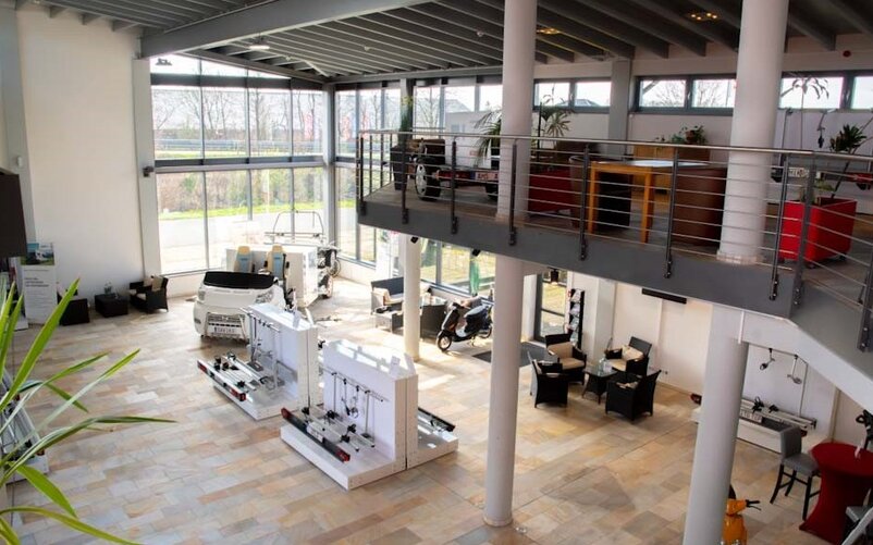 Modernly furnished showroom with large front-facing windows